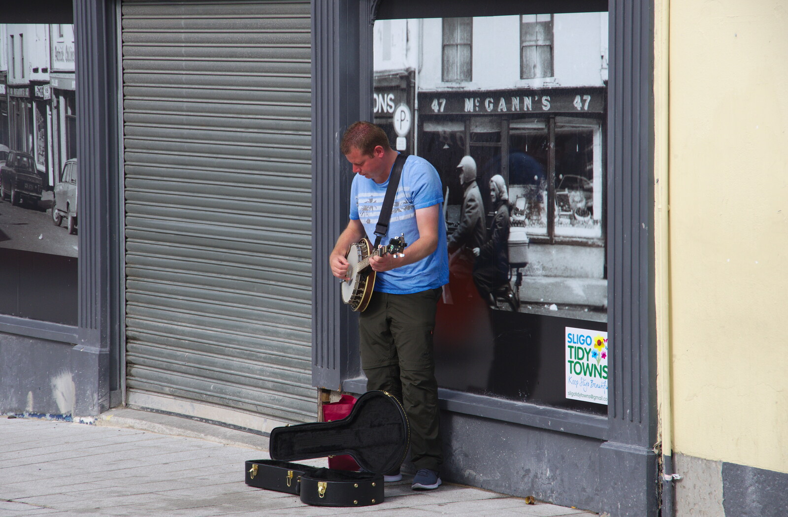 A dude plays the banjo on a street corner from Florence Court and a Postcard from Sligo, Fermanagh and Sligo, Ireland - 21st August 2019