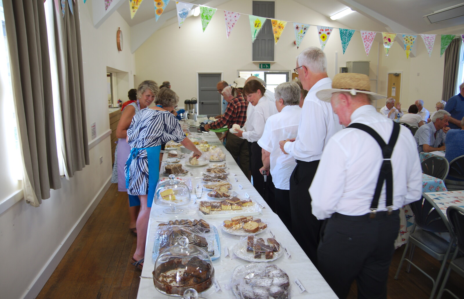 The band queues up for some tea and cake from The Gislingham Silver Band at Walsham Le Willows, Suffolk - 26th August 2019