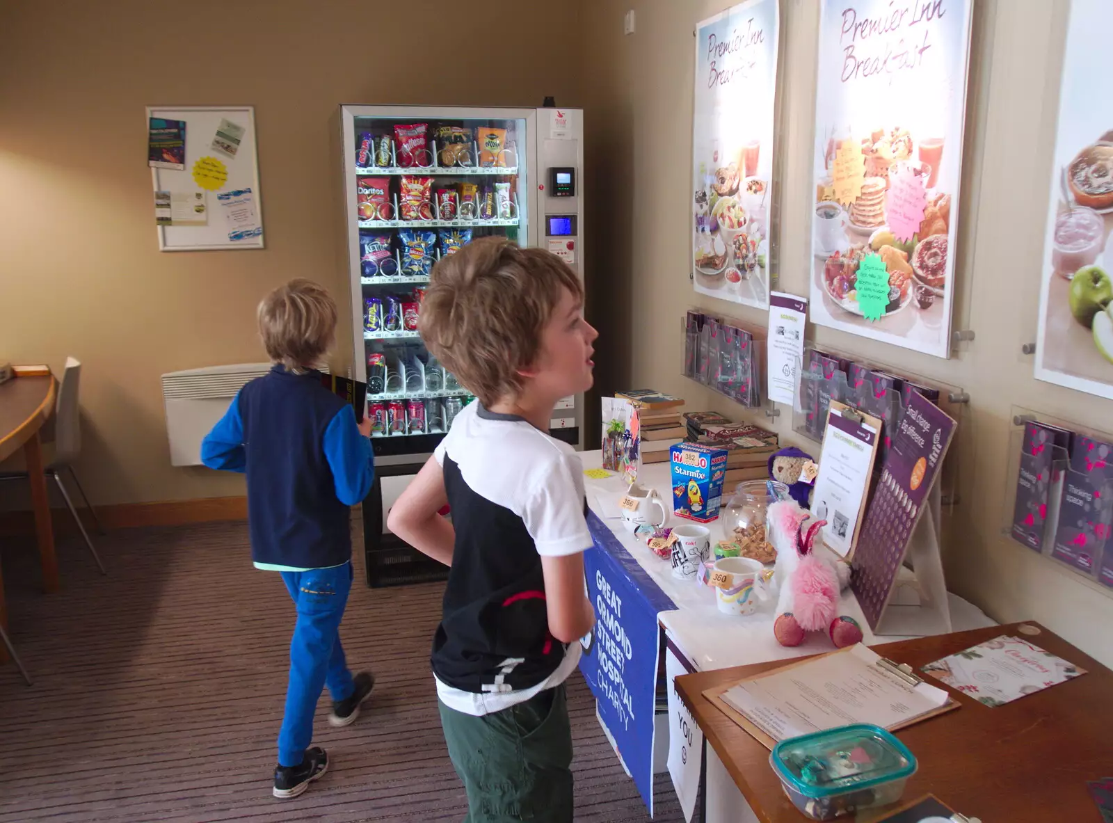 The boys are drawn to a charity tombola, from A Trip to the South Coast, Highcliffe, Dorset - 20th September 2019