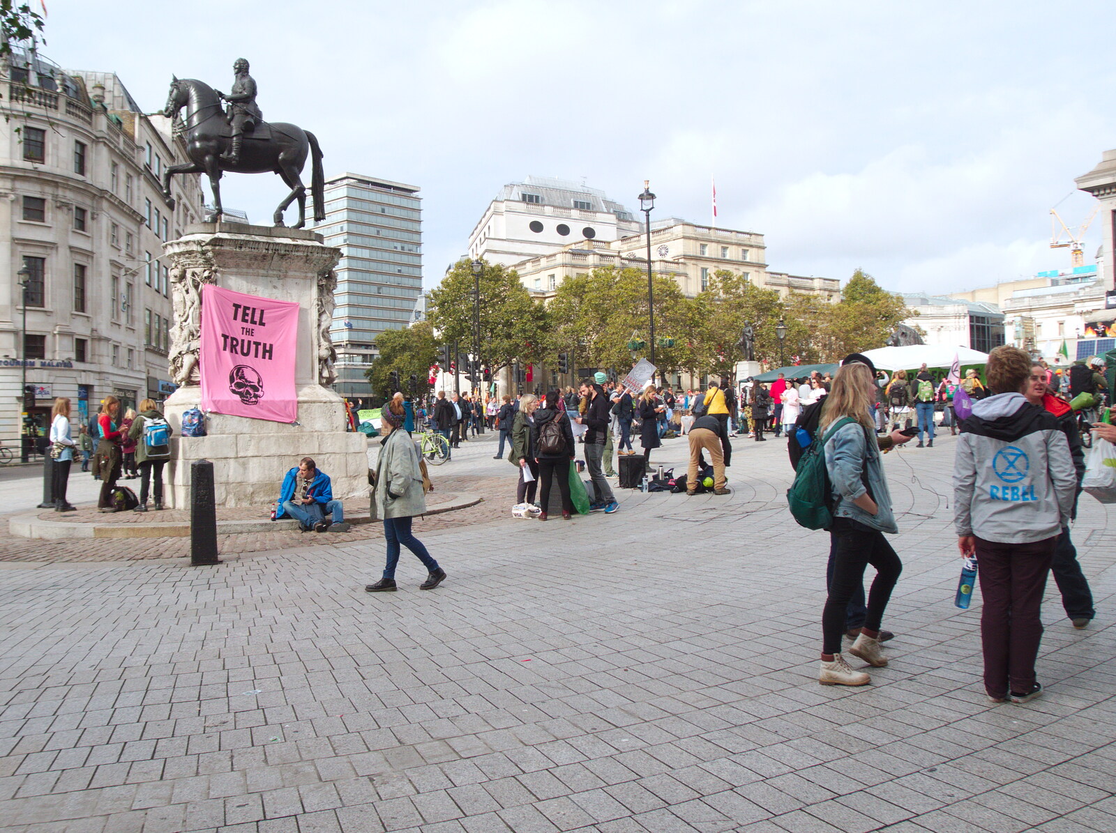 People roam around under a 'Tell the truth' banner from The Extinction Rebellion Protest, Westminster, London - 9th October 2019