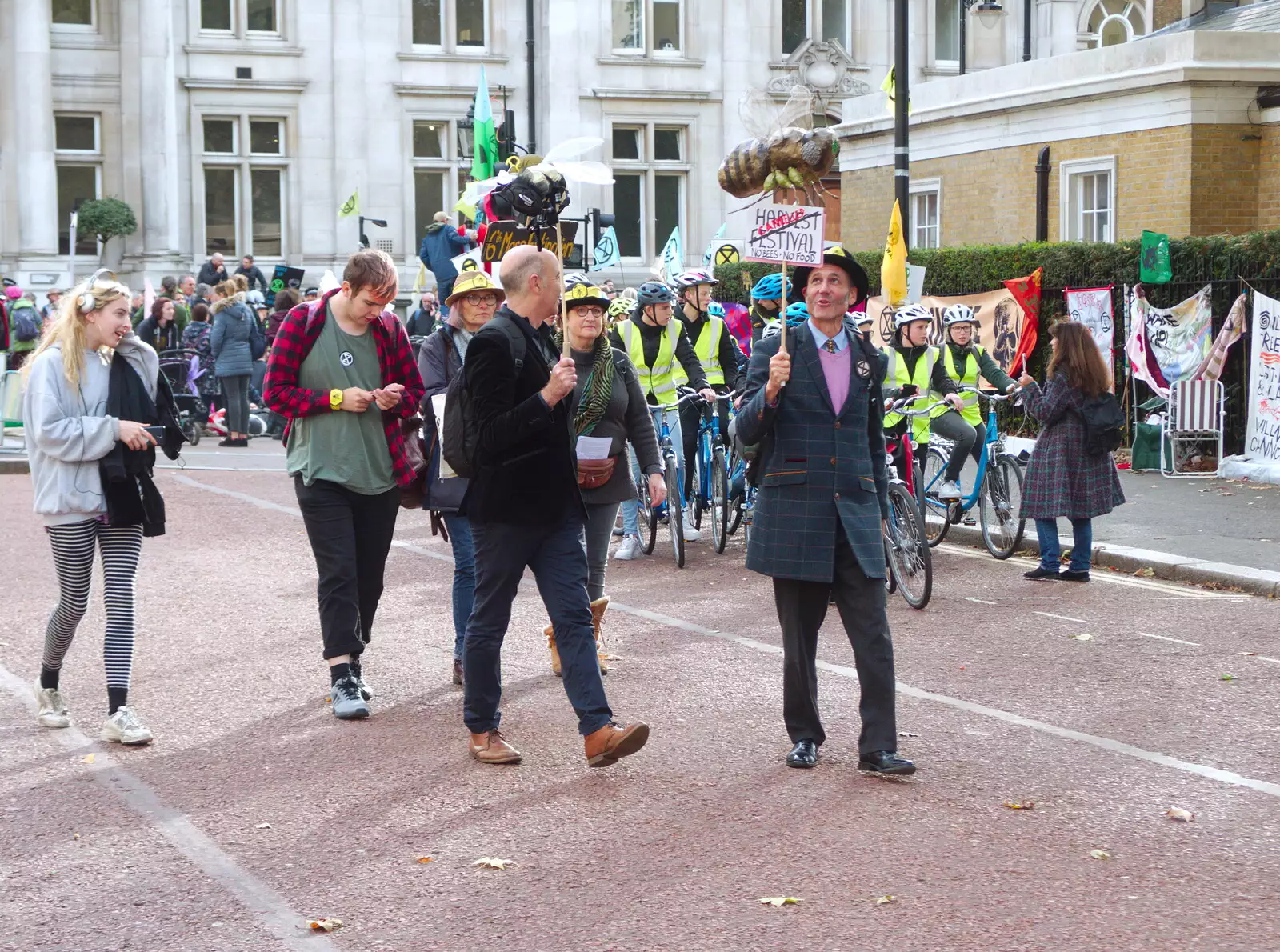 Protestors carry some oversized bees on a stick, from The Extinction Rebellion Protest, Westminster, London - 9th October 2019