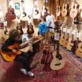 Fred and Harry try guitars in Cooke's, A Trip up the Big City, Norwich, Norfolk - 18th October 2019