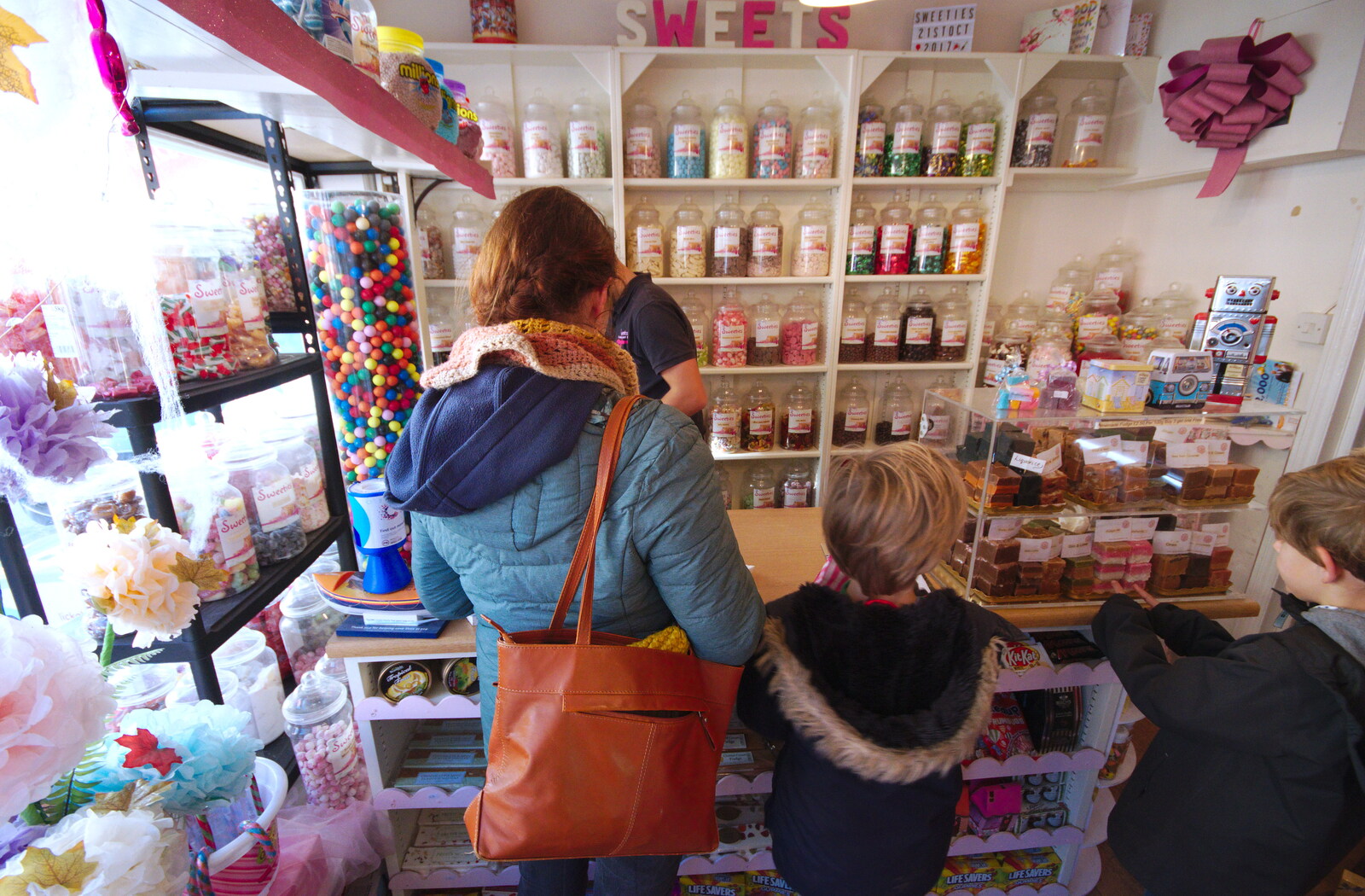Isobel pays for stuff in the sweet shop from A Trip up a Lighthouse, Southwold, Suffolk - 27th October 2019