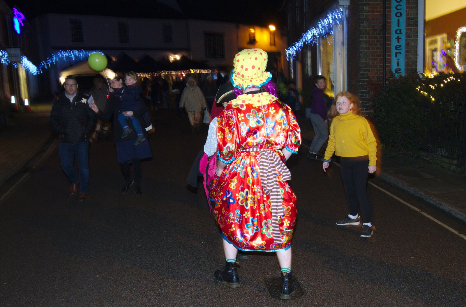 A pantomime dame walks up Broad Street from Isobel Sings at the Eye Lights, Eye, Suffolk - 28th November 2019