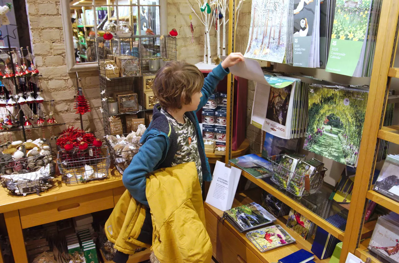 Fred looks at calendars back in the NT shop, from The Tiles of Ickworth House, Horringer, Suffolk - 30th November 2019