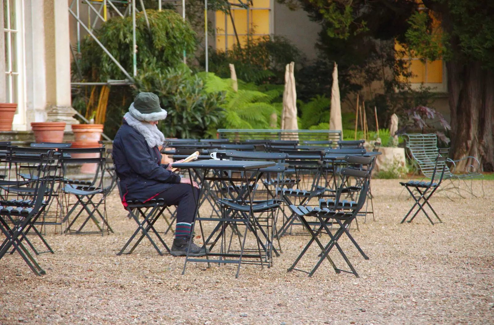 A brave soul reads a book outside, from The Tiles of Ickworth House, Horringer, Suffolk - 30th November 2019