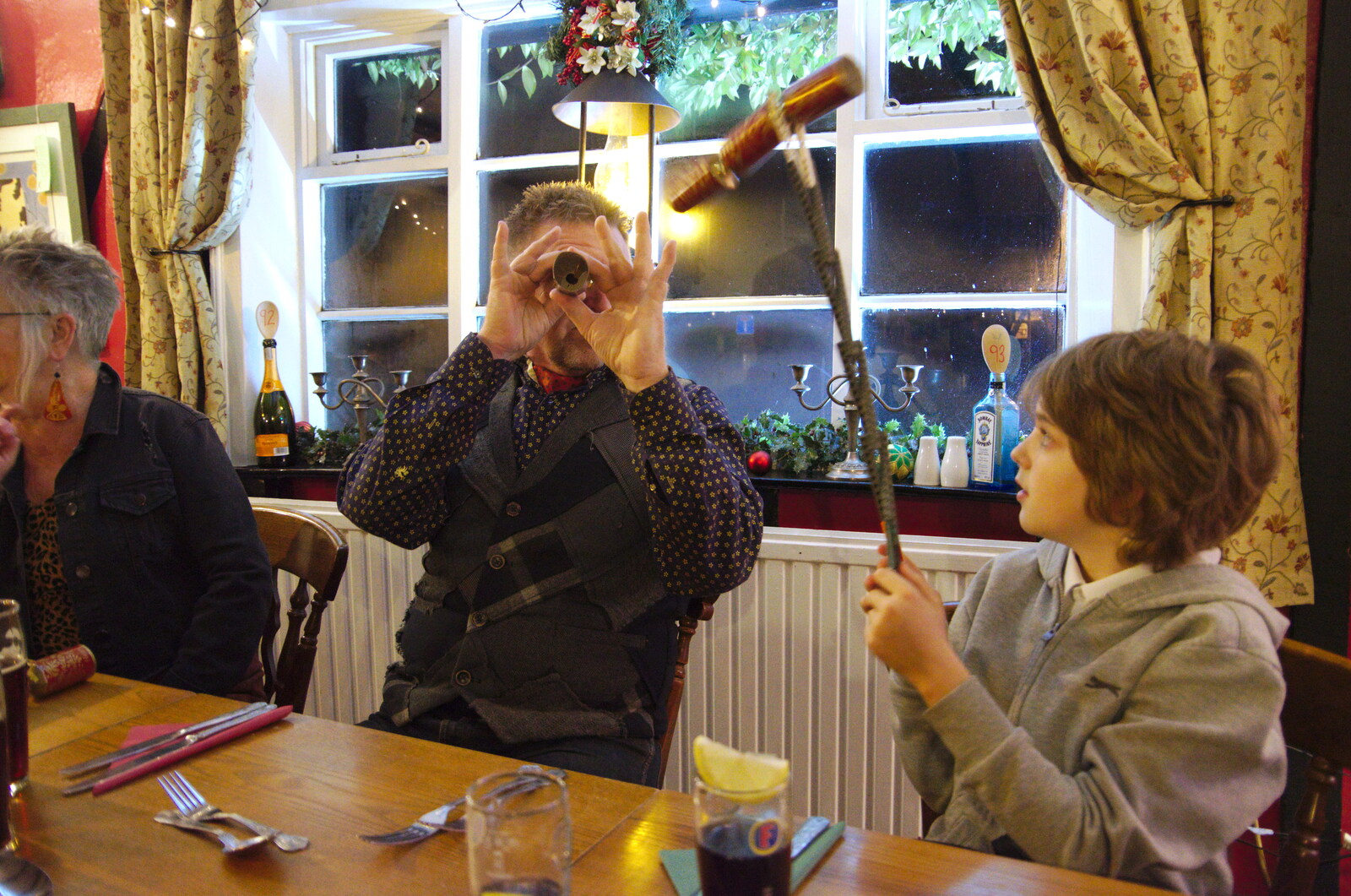 Gaz pretends that a cracker is a telescope from GSB Concerts and the BSCC Christmas Dinner, Suffolk - 13th December 2019