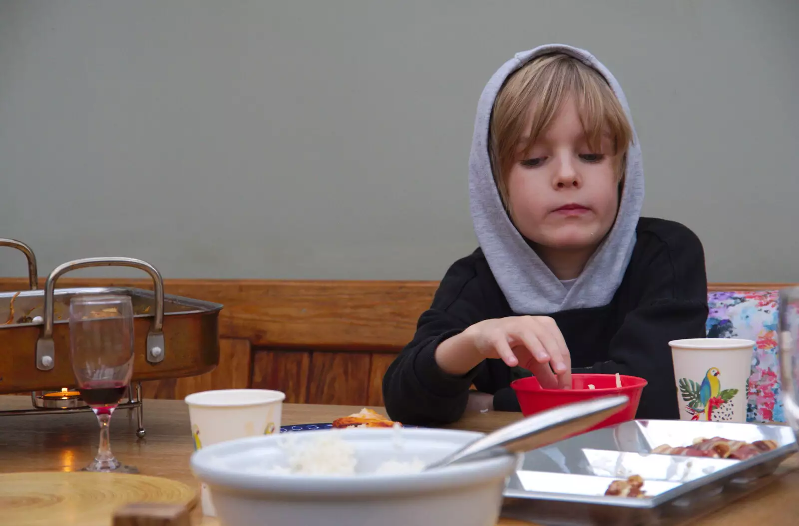 Harry tentatively eats French Fries, from A Spot of Christmas Shopping, Norwich, Norfolk - 23rd December 2019