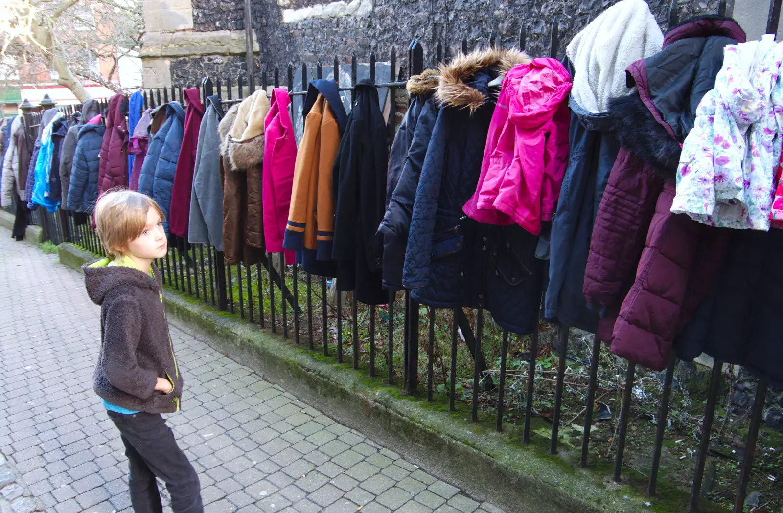 Harry considers a line of coats for the homeless, from A Spot of Christmas Shopping, Norwich, Norfolk - 23rd December 2019