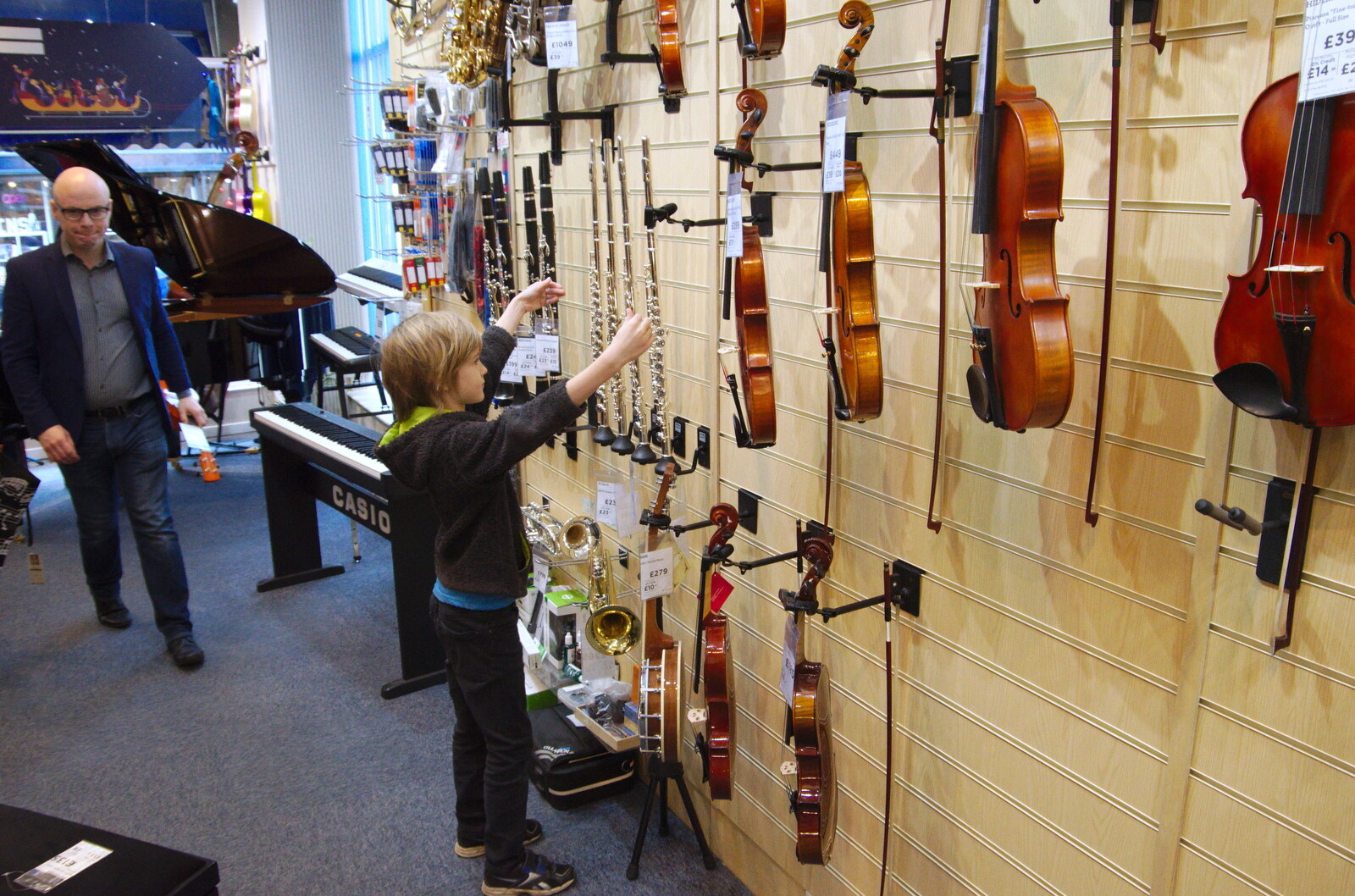 Harry looks at flutes and violins in Cooke's from A Spot of Christmas Shopping, Norwich, Norfolk - 23rd December 2019