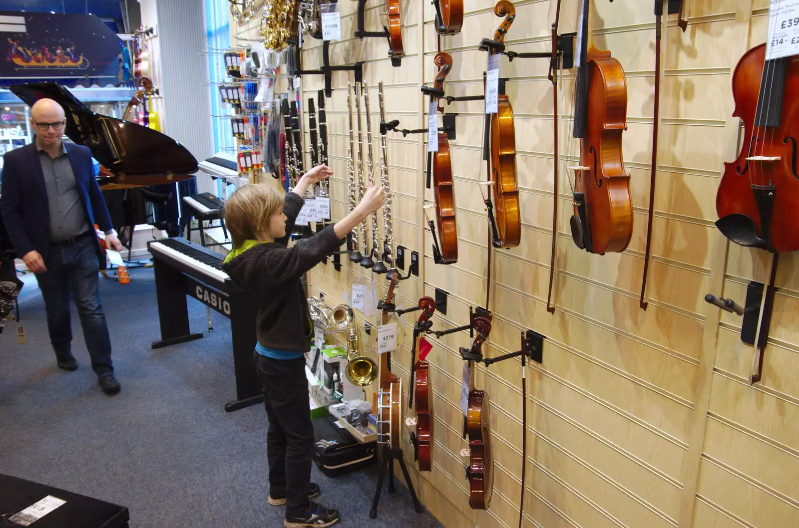 Harry looks at flutes and violins in Cooke's, from A Spot of Christmas Shopping, Norwich, Norfolk - 23rd December 2019