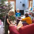 Fred and Harry open an early present each, A Christingle Service, St. Nicholas Church, Oakley, Suffolk - 24th December 2019