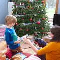 Harry's got a Christmasaurus book, A Christingle Service, St. Nicholas Church, Oakley, Suffolk - 24th December 2019