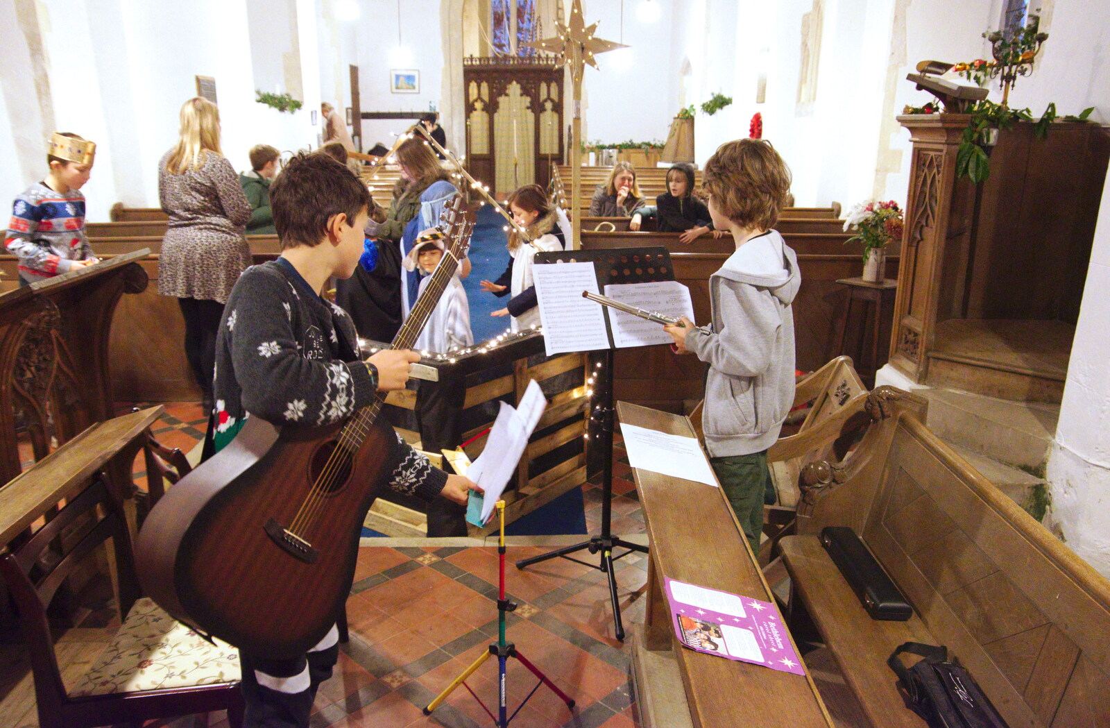 Matthew checks music from A Christingle Service, St. Nicholas Church, Oakley, Suffolk - 24th December 2019