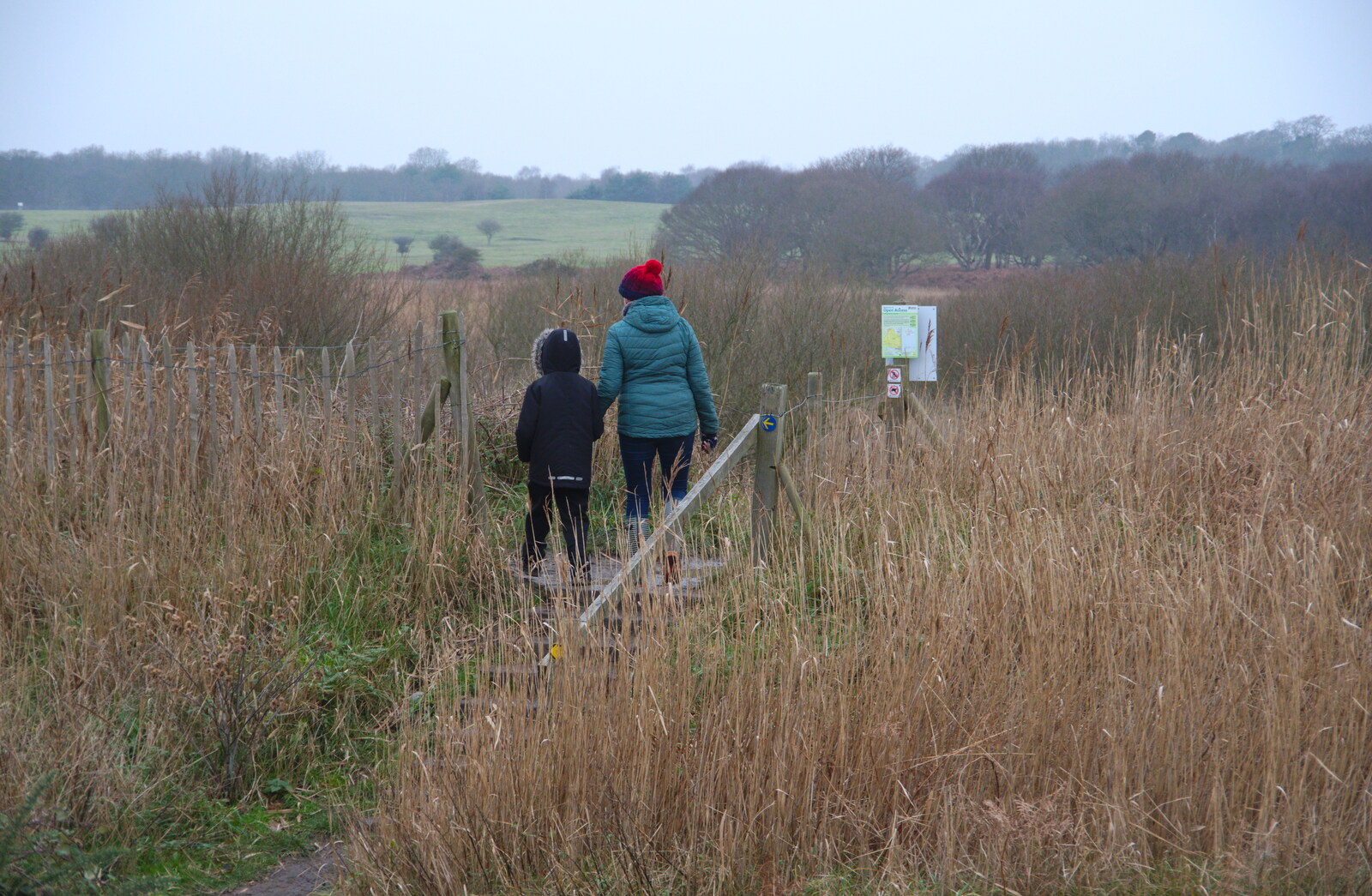Harry and Isobel head off to the marshes from A Trip to the Beach, Dunwich Heath, Suffolk - 27th December 2019