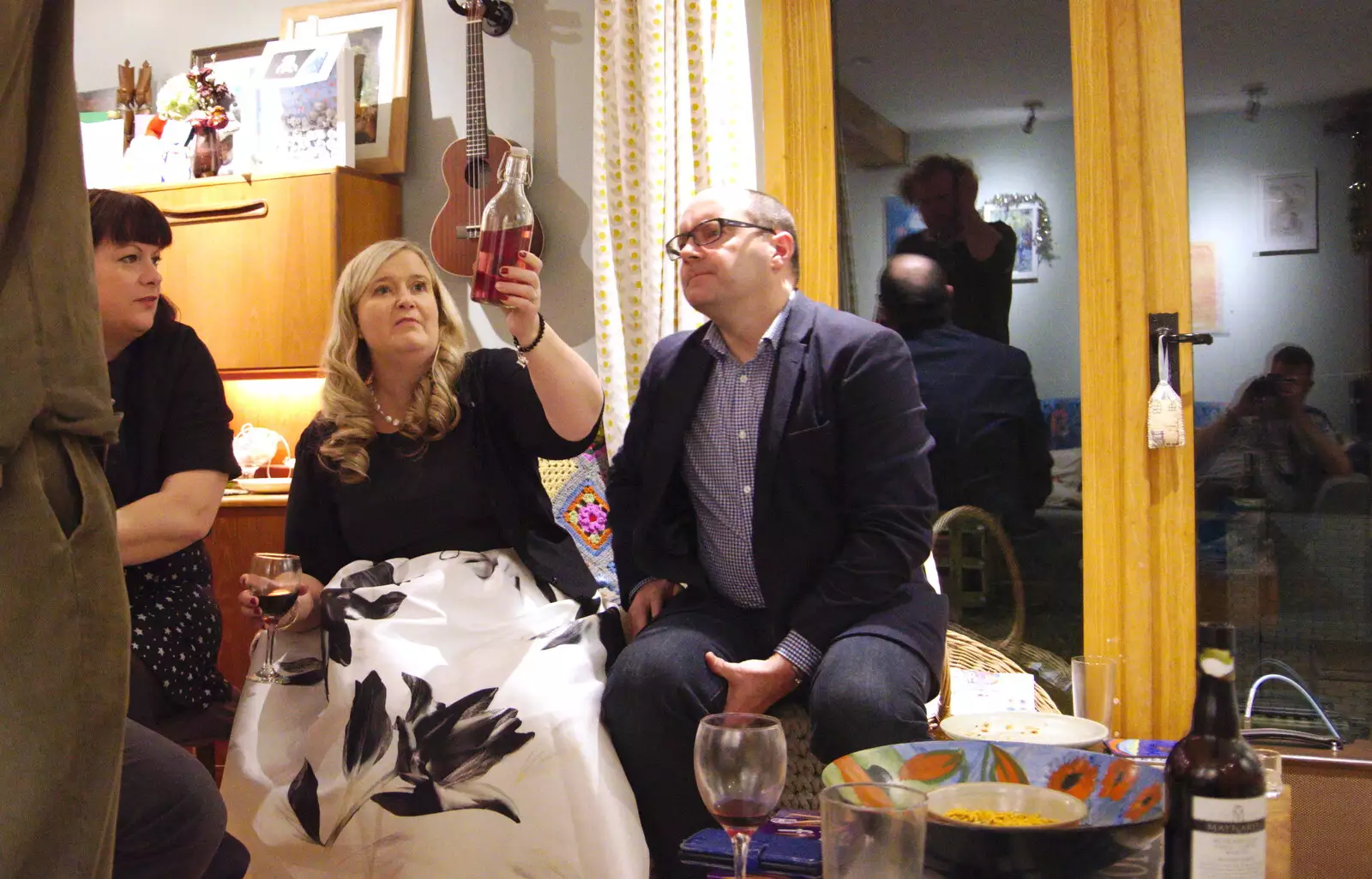 Helen warily inspects Wavy's bottle of booze, from A New Year's Eve Party, Brome, Suffolk - 31st December 2019