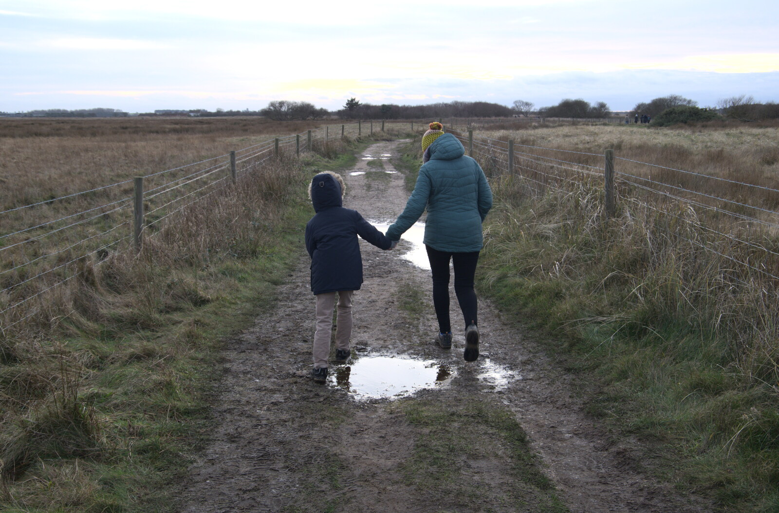 Harry and Isobel navigate the path back from To See the Seals, Horsey Gap, Norfolk - 10th January 2020