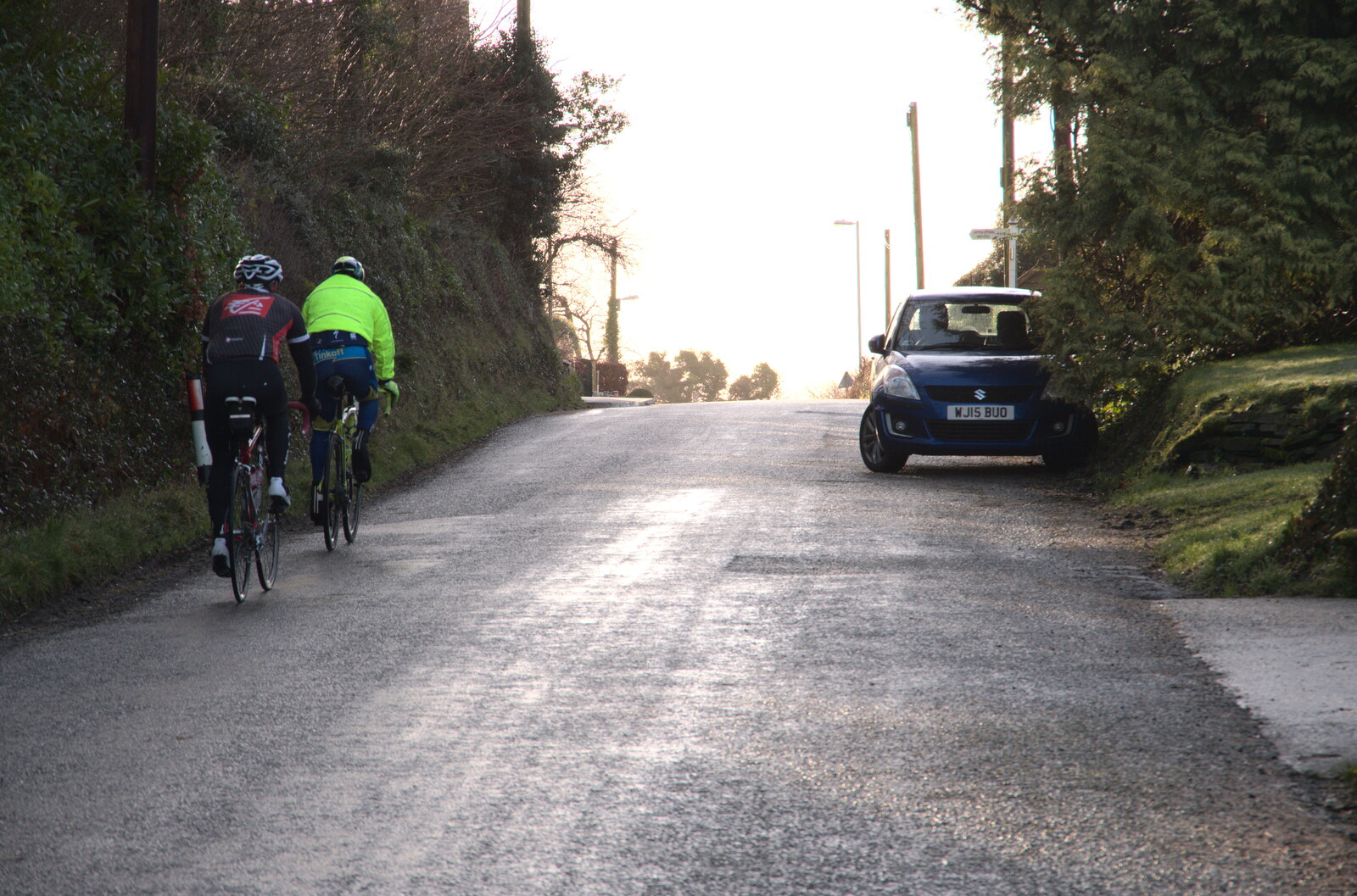 A couple of cyclists stomp up the hill from A Short Trip to Spreyton, Devon - 18th January 2020