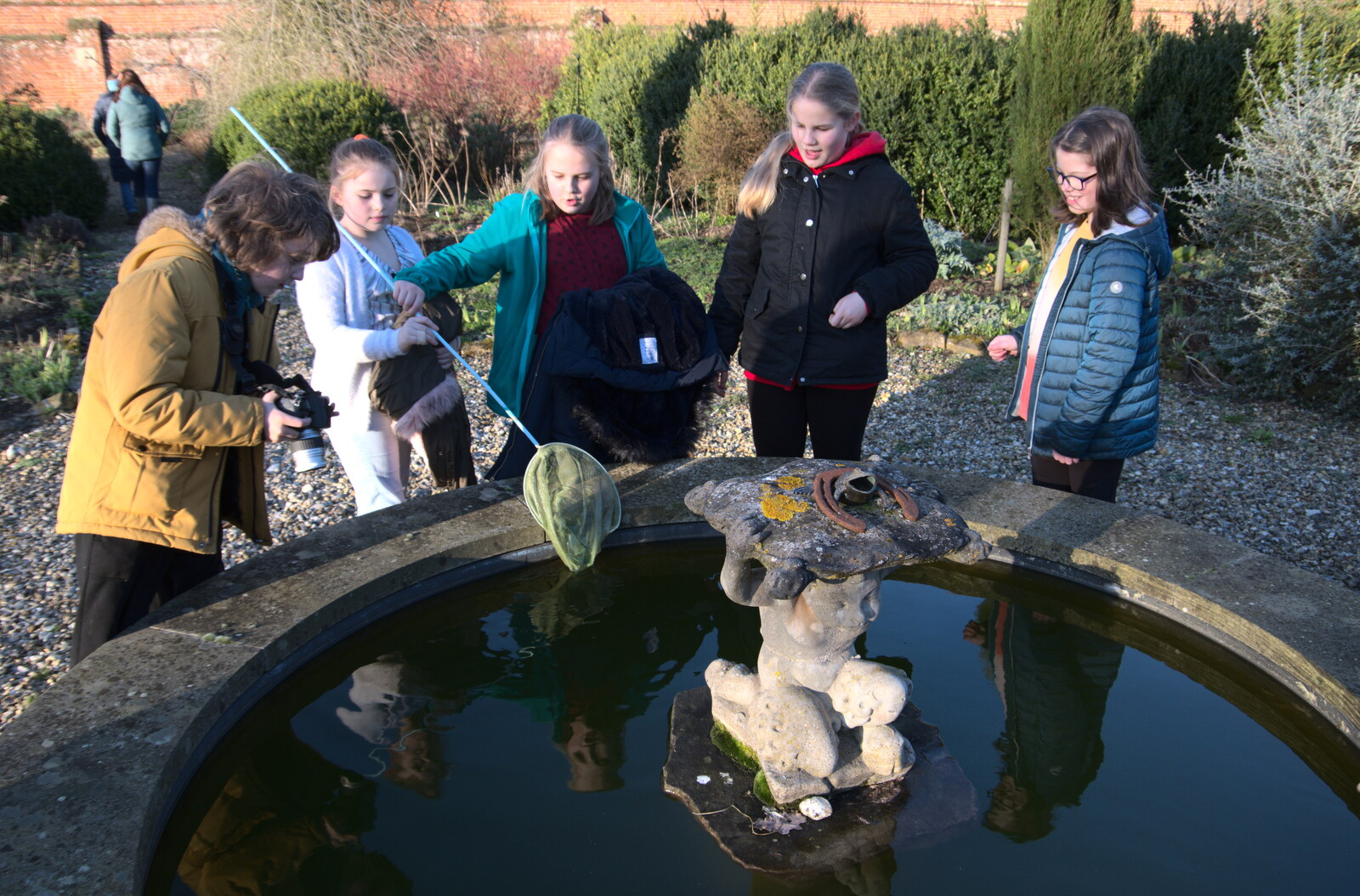 There's some messing around in an ornamental pond from Snowdrops at Talconeston Hall, Tacolneston, Norfolk - 7th February 2020