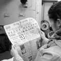 Isobel reads the news, HMS Belfast and the South Bank, Southwark, London - 17th February 2020