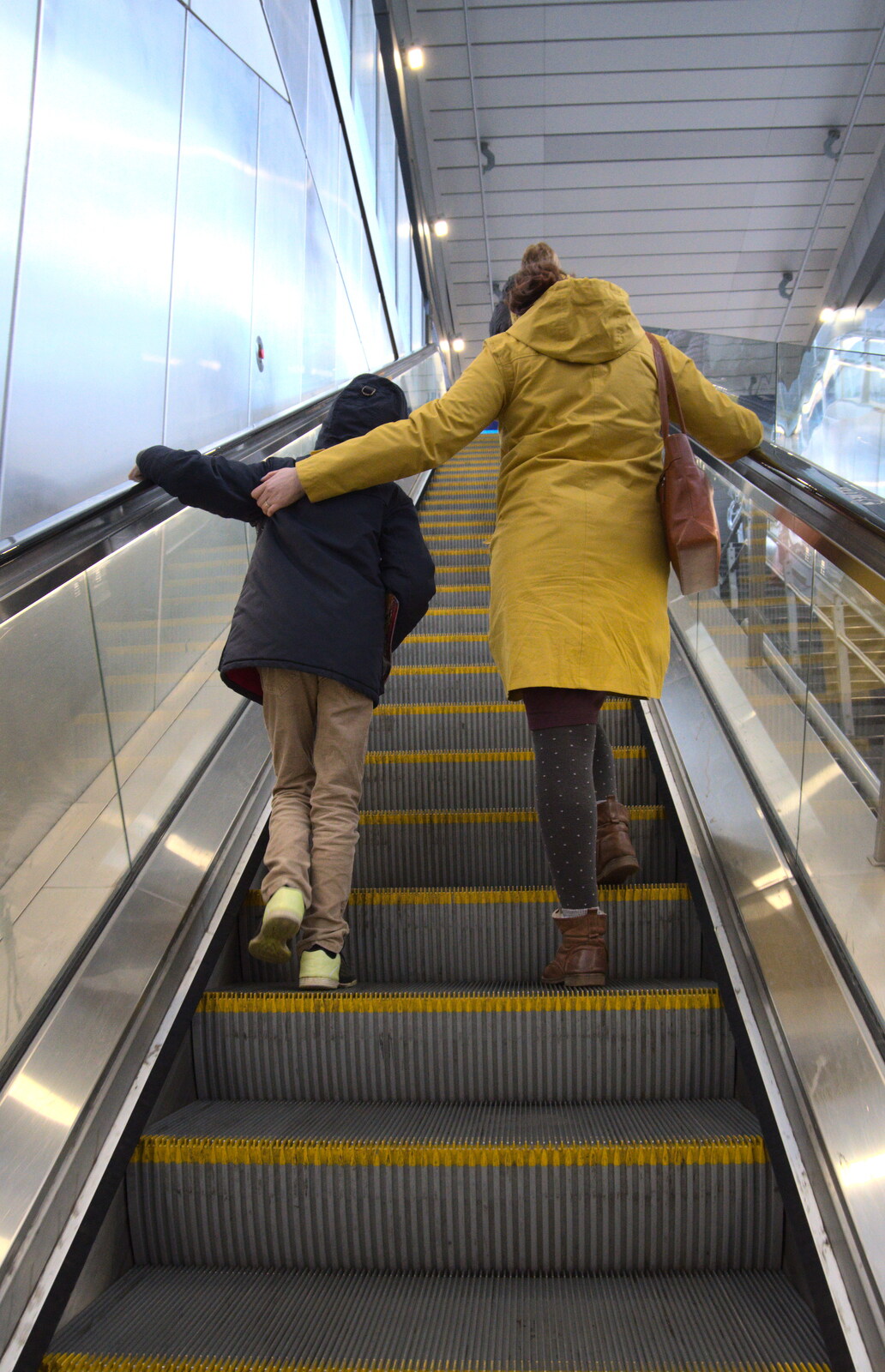 Harry and Isobel on the escalator from HMS Belfast and the South Bank, Southwark, London - 17th February 2020