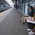 The boys read magazines as we wait for our train, HMS Belfast and the South Bank, Southwark, London - 17th February 2020