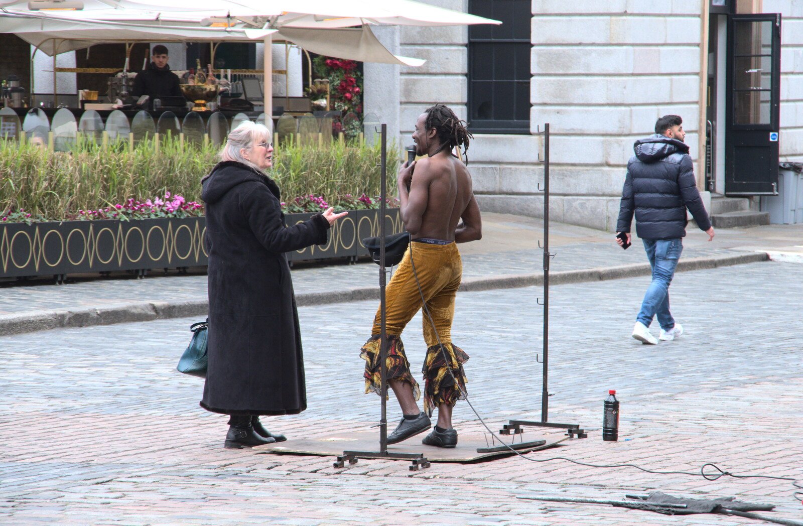 The limbo dancer has a chat from A SwiftKey Memorial Service, Covent Garden, London  - 13th March 2020