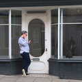 Some dude checks his phone outside an empty shop, A Trip to Cooke's Music, St. Benedict's Street, Norwich - 14th March 2020