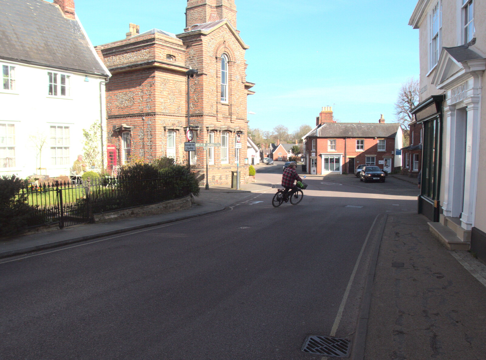A lone cyclist pedals up Church Street from An April Lockdown Miscellany, Eye, Suffolk - 10th April 2020