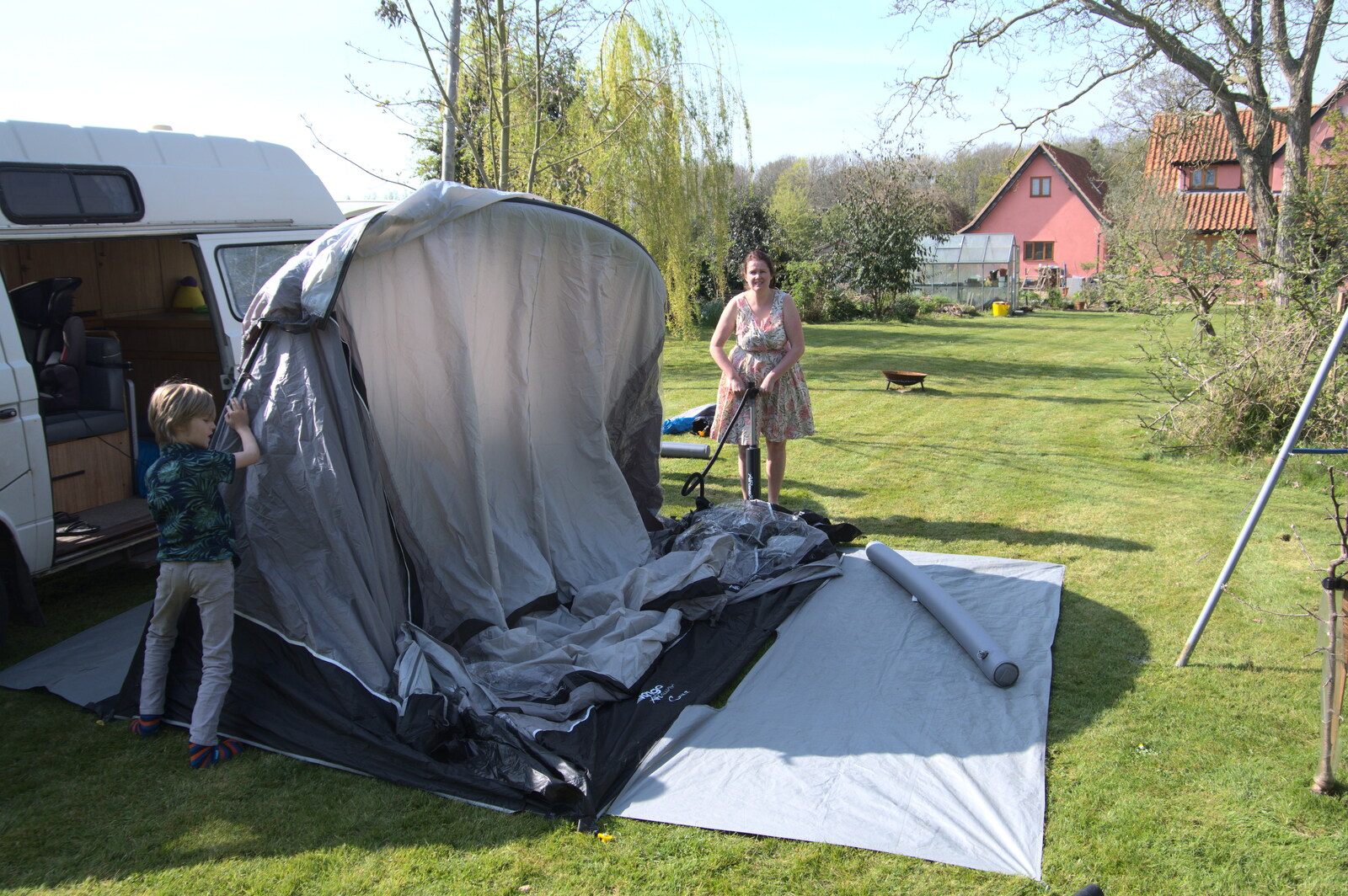 Isobel pumps the awning up from A Weekend Camping Trip in the Garden, Brome, Suffolk - 11th April 2020