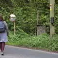 Isobel goes to inspect an old egg box, The Quest for Rapsy Tapsy Lane, Eye, Suffolk - 6th May 2020