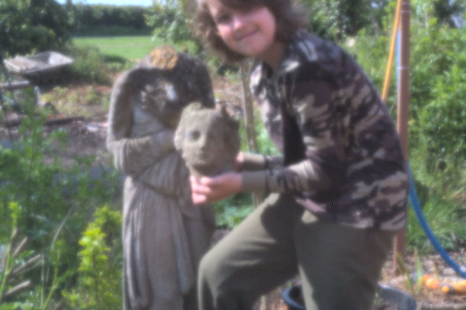 Fred holds up the detatched statue head from Pin-hole Cameras and a Red Arrows Flypast, Brome, Suffolk - 8th May 2020