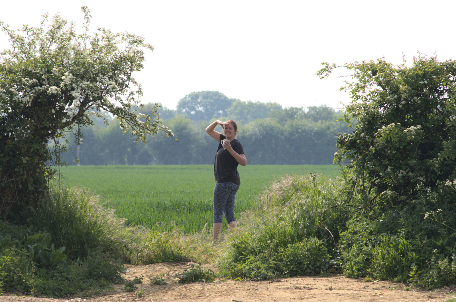 Isobel looks around for more low-flying planes from Pin-hole Cameras and a Red Arrows Flypast, Brome, Suffolk - 8th May 2020