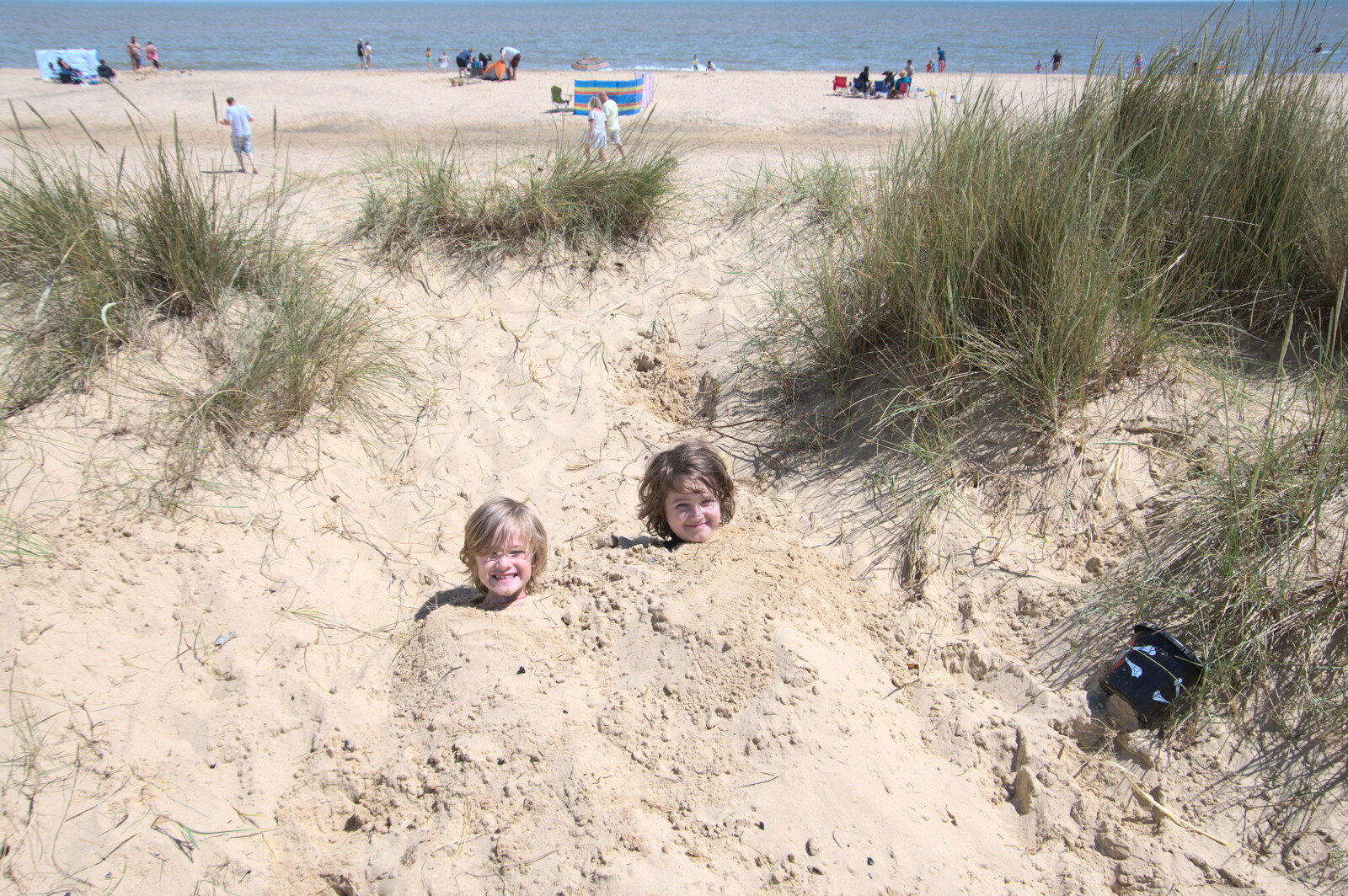 The boys get buried in sand from A Return to Southwold, Suffolk - 14th June 2020