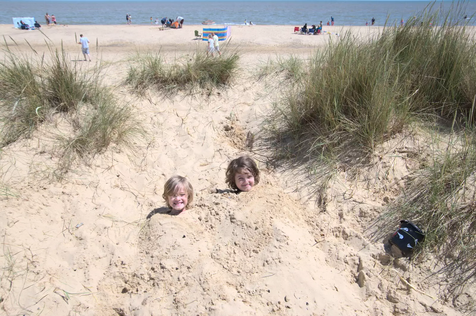 The boys get buried in sand, from A Return to Southwold, Suffolk - 14th June 2020