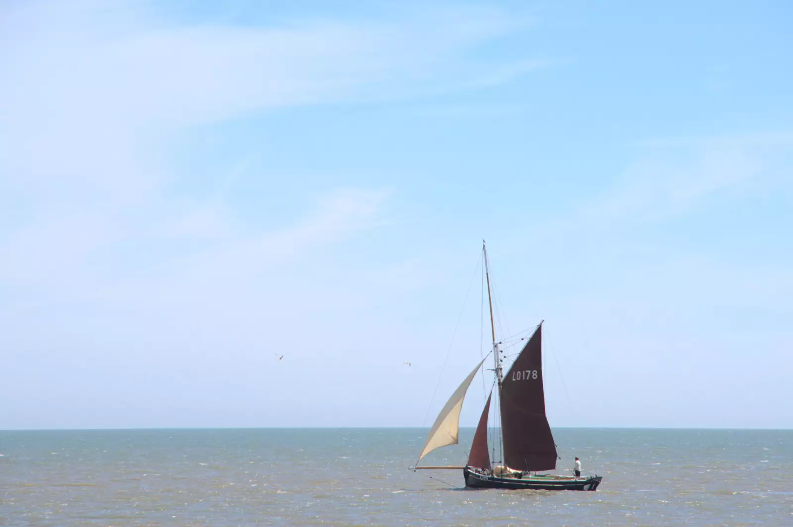 The fishing boats sails off along the coast, from A Return to Southwold, Suffolk - 14th June 2020