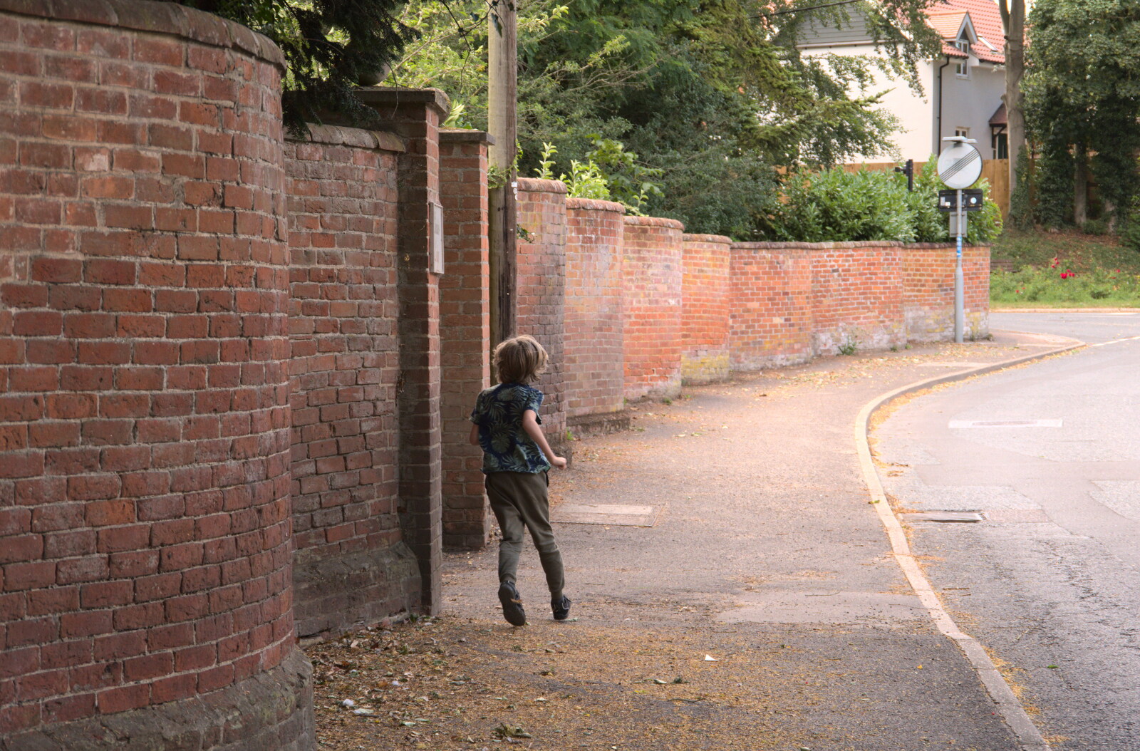 Harry runs in and out of the Crinkle Crankle Wall from A Walk Around Abbey Bridges, Eye, Suffolk - 5th July 2020