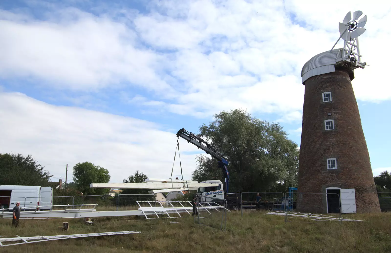 The arm is gingerly lifted off the ground, from A Sail Fitting, Billingford Windmill, Billingford, Norfolk - 20th August 2020