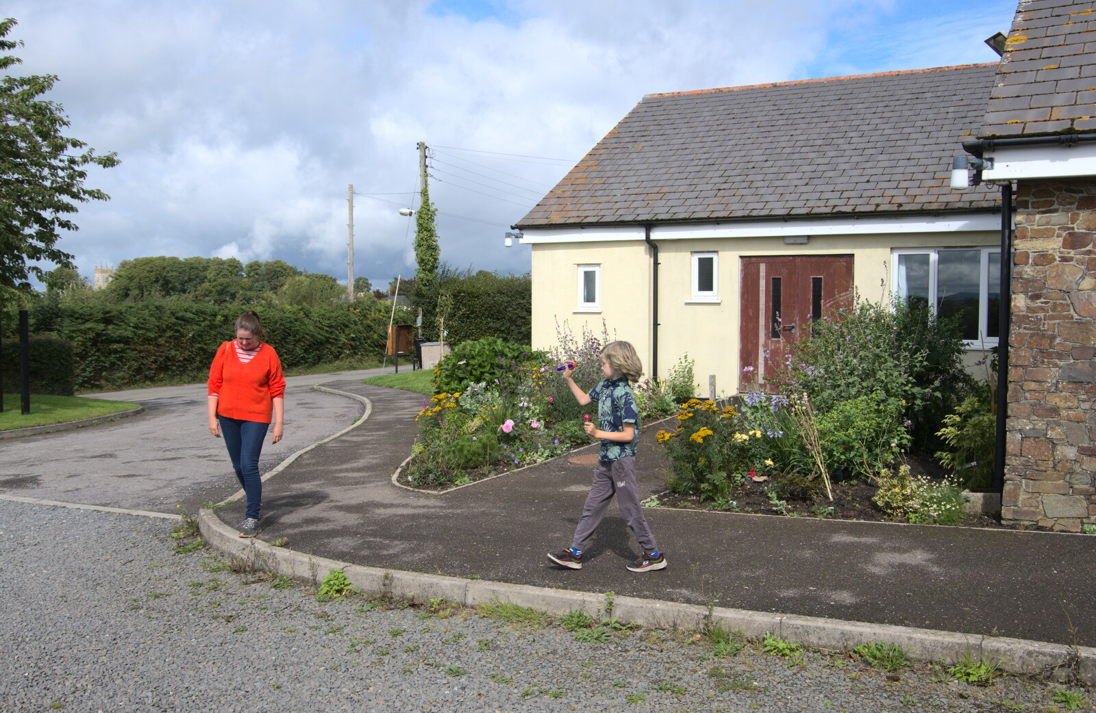 Isobel wanders past the village hall from A Game of Cricket, and a Walk Around Chagford, Devon - 23rd August 2020