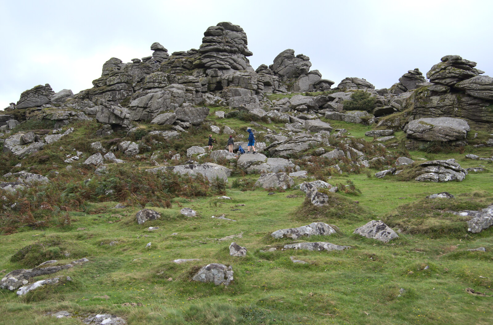 The boys head off into the rocks from A Walk up Hound Tor, Dartmoor, Devon - 24th August 2020