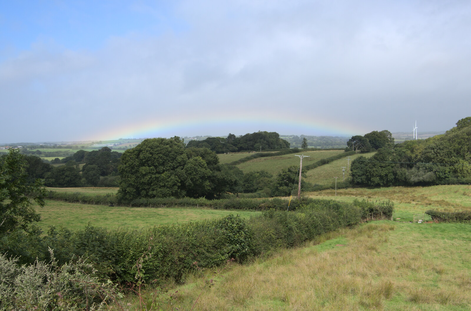 There's a very low rainbow over the valley from A Walk up Hound Tor, Dartmoor, Devon - 24th August 2020
