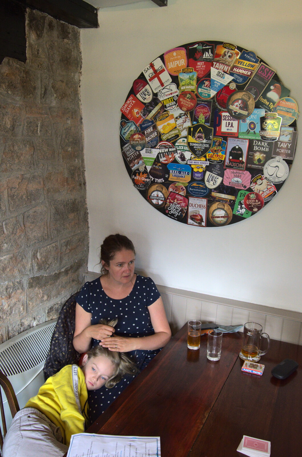 Isobel and Harry under a load of beer mats from A Walk up Hound Tor, Dartmoor, Devon - 24th August 2020