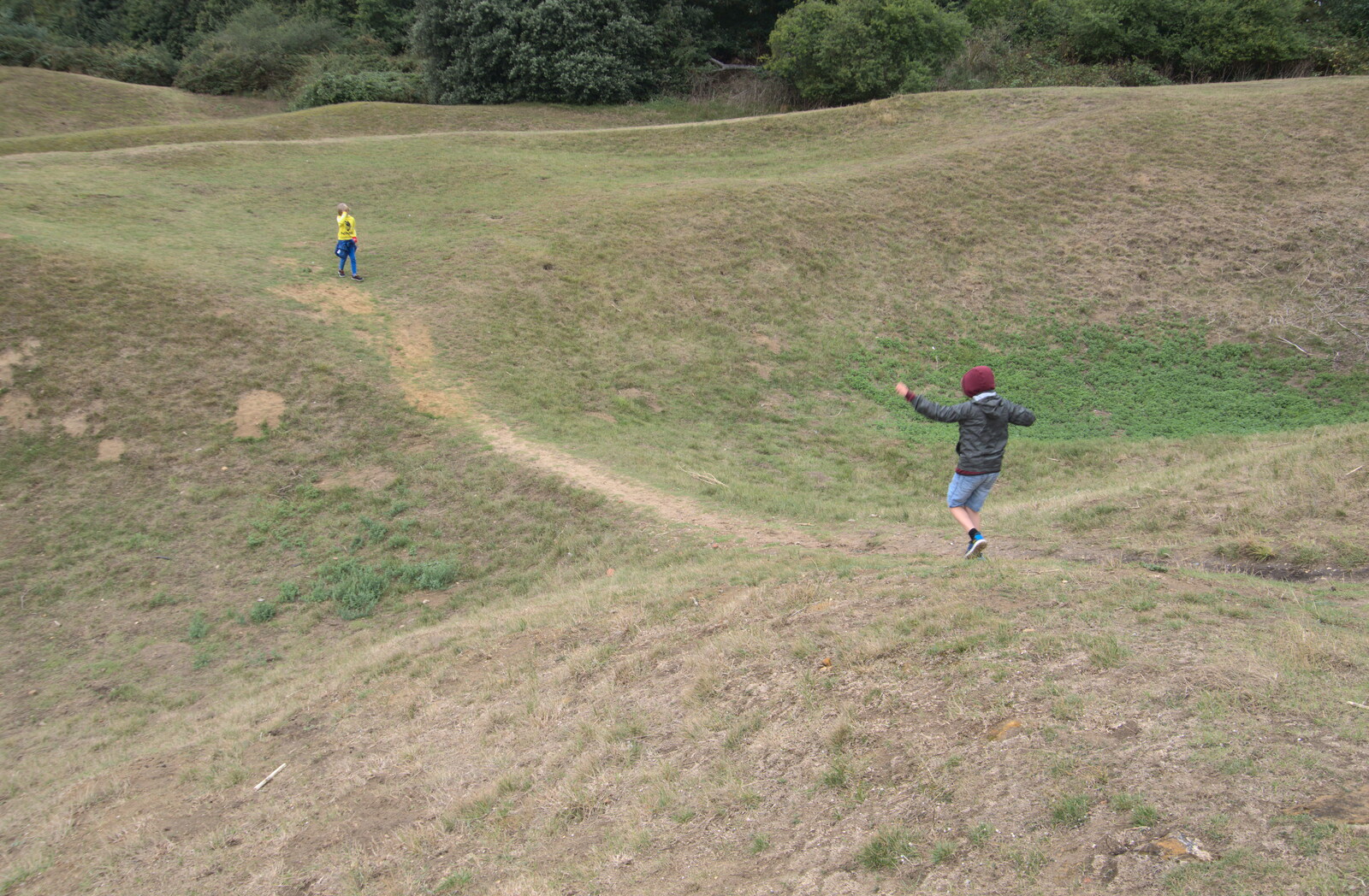 The boys run up and down the dry moat from A Trip to Orford, Suffolk - 29th August 2020
