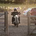 A bloke on a motorbike makes a dusty entrance, Star Wing's Hops and Hogs Festival, Redgrave, Suffolk - 12th September 2020