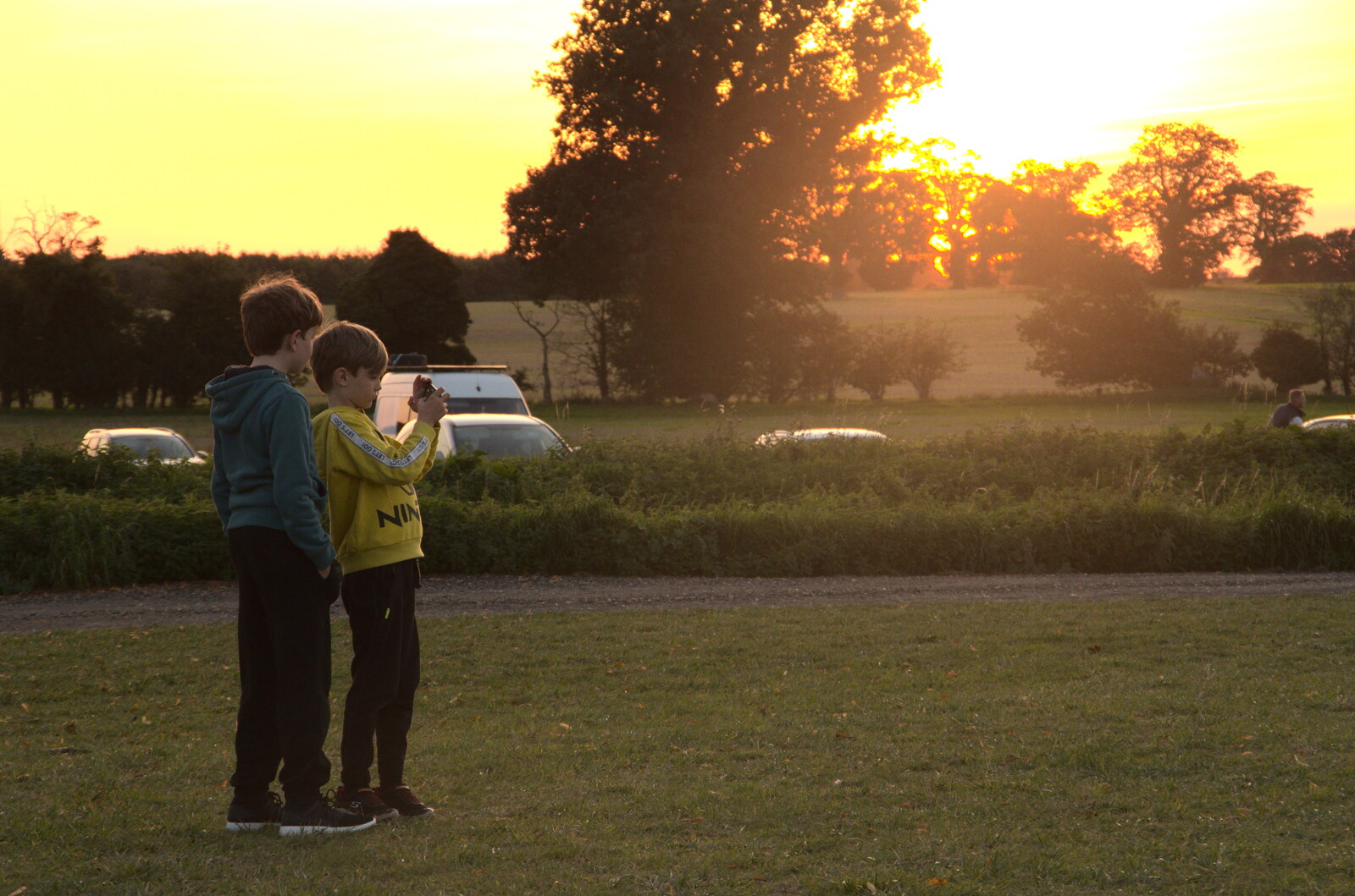 Fred and Harry with a phone, in the sunset from Star Wing's Hops and Hogs Festival, Redgrave, Suffolk - 12th September 2020