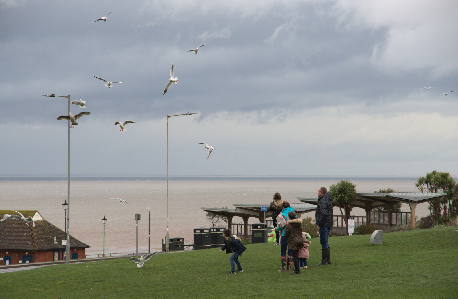 Kids lob bread at the gulls from A Postcard From Kings Lynn and "Sunny Hunny" Hunstanton, Norfolk - 31st October 2020