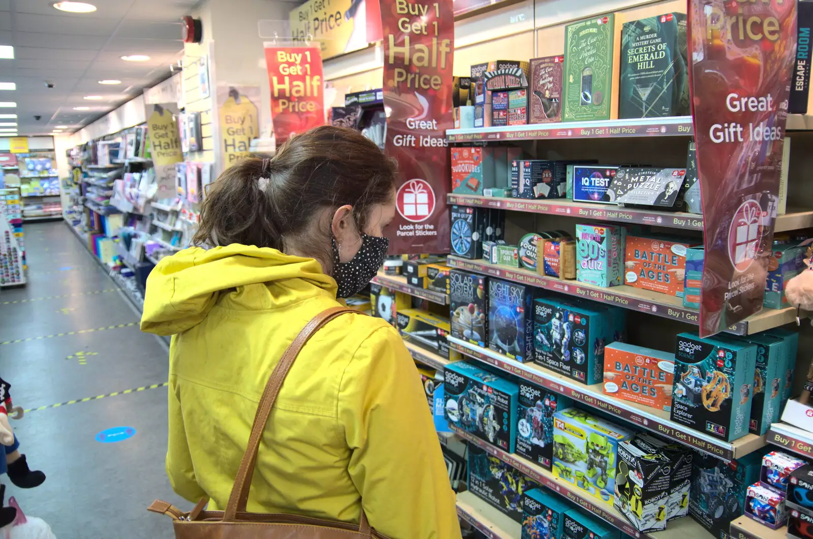 Isobel looks at board games, from Isobel's Birthday, Woodbridge, Suffolk - 2nd November 2020