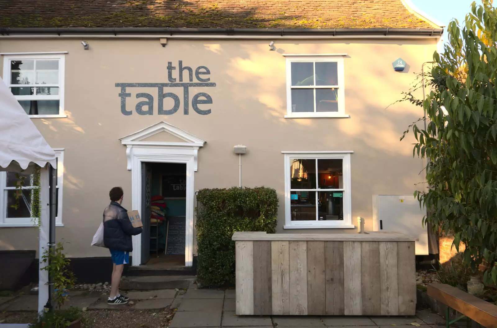 A delivery dude waits outside the café, from Isobel's Birthday, Woodbridge, Suffolk - 2nd November 2020