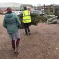 Our tree is hauled off to be string-bagged, Frosty Rides and a Christmas Tree, Diss Garden Centre, Diss, Norfolk - 29th November 2020