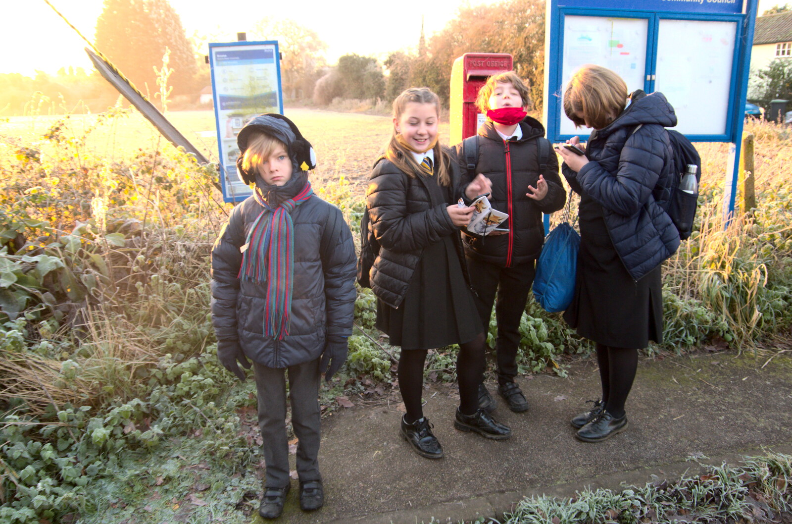 Waiting at the bus stop, with phones from A Return to the Oaksmere, Brome, Suffolk - 8th December 2020